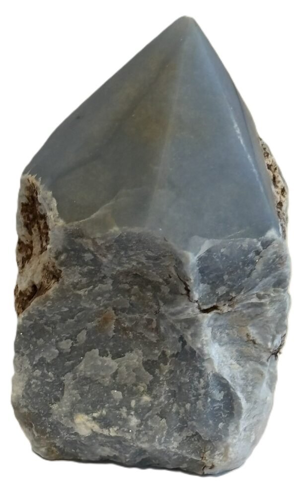 Natural rough angelite freeform with polished point 3 sians emporium Natural rough angelite freeform crystal with unpolished sides and a smooth polished blue point standing on a white background